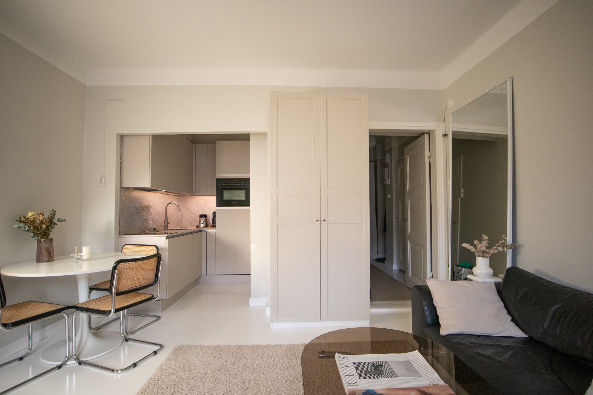 Compact dining nook and kitchenette in a bright rental apartment